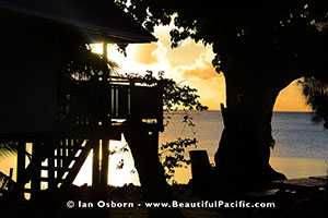 sunsetting over  lagoon at the aitutaki beach villas